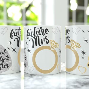 May include: Three white ceramic mugs with bridal-themed designs. One mug features a sparkly dress and the text "and they lived happily ever after." Another says "future Mrs" with a ring graphic. The third mug says "I said Yes."