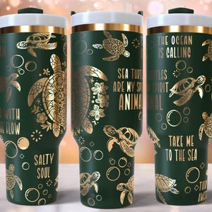 May include: Three green stainless steel tumblers with gold accents and a sea turtle theme. The tumblers feature different designs with text that reads "The ocean is calling", "Sea turtles are my spirit animal", and "Take me to the sea".