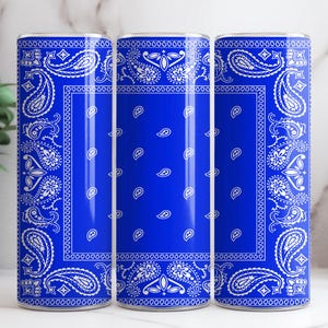 May include: Three blue and white patterned stainless steel tumblers. The tumblers have a white bandana pattern on a royal blue background.