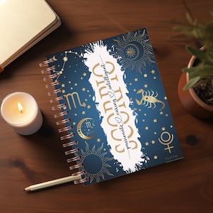 May include: A blue spiral bound journal with a gold design featuring the zodiac sign Scorpio and the text "Passionate, Caring, Intelligent".