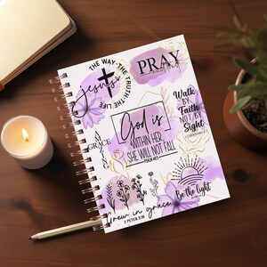 May include: A purple and gold spiral bound journal with inspirational quotes and bible verses. The cover features a cross, flowers, and the words "God is within her, she will not fall" and "Grew in grace".