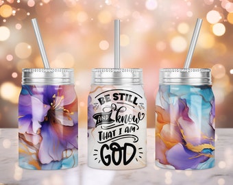 May include: Three stainless steel tumblers with lids and straws. The tumblers have a white background with a floral design and the words "Be Still and Know That I Am God".