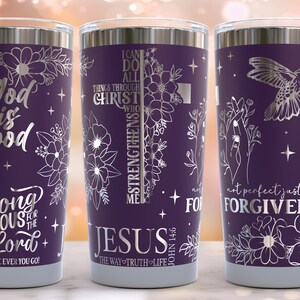 May include: Three purple stainless steel tumblers with silver floral designs and inspirational quotes. The quotes are "God is Good", "I can do all things through Christ who strengthens me", and "Not perfect just forgiven".