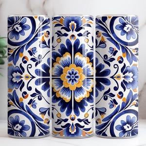May include: Three stainless steel tumblers with a blue and white floral pattern. The pattern is reminiscent of traditional Portuguese tiles.