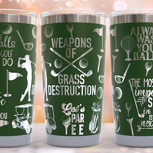 May include: Three green stainless steel tumblers with white golf-themed designs. The tumblers feature sayings like "It takes a lot of balls to golf like I do", "Weapons of Grass Destruction", and "Always wash your balls".