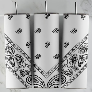 May include: Three white stainless steel tumblers with a black and white bandana print. The tumblers have a black and white paisley pattern on the bottom third of the tumbler.