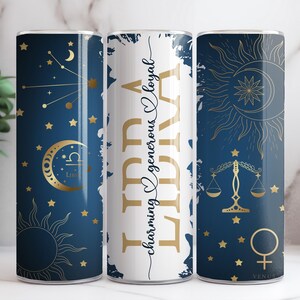 May include: Three stainless steel tumblers with a blue and gold design featuring the zodiac sign Libra, the scales of justice, and the text "Libra charming ♥ generous ♥ loyal".