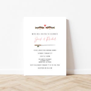May include: White wedding shower invitation with watercolor illustrations of two fish and a fishing rod. The text reads "We're reel excited to celebrate" and includes the names Jack & Rachel. Additional text provides event details.