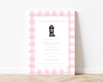 May include: Pink and white gingham baby shower invitation with a black and white illustration of a dog wearing a pink bow. The text reads "Rose is getting a little sister. Please join us for a Baby Shower celebrating Emmy Smith. Sunday, January 5, 2021, 12:00PM. 123 Main Street, Atlanta, GA 30333. RSVP to the Smith at 221-456-7890. Registered on Babylist.com."