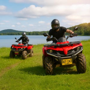 May include: Two red ATVs are driven on a grassy field near a lake. Each ATV has a rider wearing a black helmet and clothing. The ATVs have black tires and headlights. The license plate on the front ATV reads "BGT-243 COLOMBIA".