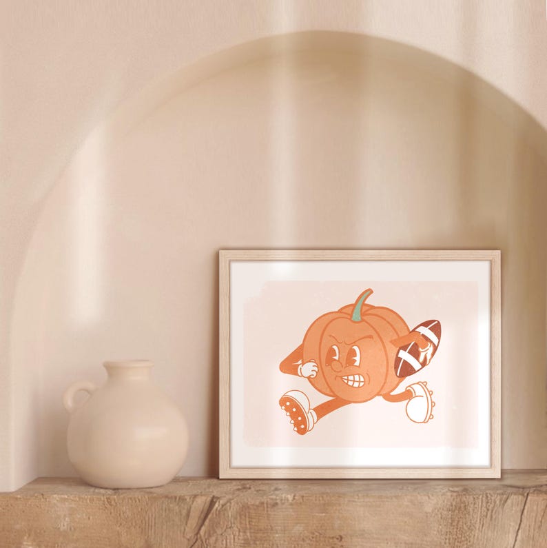 May include: A framed illustration of a cartoon pumpkin wearing a football jersey and holding a football. The pumpkin is running with a determined expression on its face.