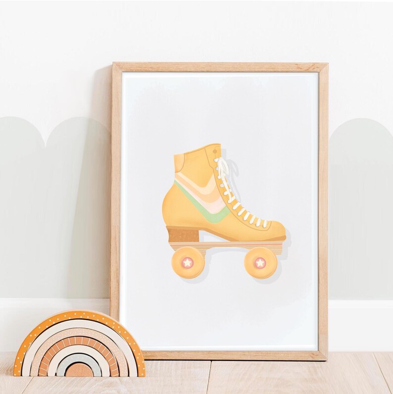 Retro art print shown in wood frame. Beige background. Yellow roller skate with green/pink/orange/paleyellow rainbow pattern in middle, stars on wheel. Retro/vintage style, pastel aesthetic,