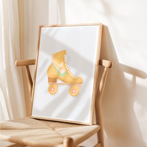 May include: A framed print of a yellow roller skate with green, pink and white stripes. The skate is on a white background.