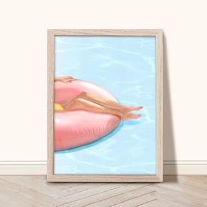 May include: A woman floats on a pink inflatable ring in a blue pool. The ring is shaped like a donut.