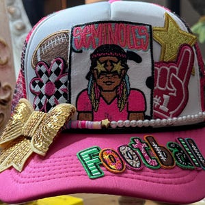 Pink and white trucker hat in a Seminole football theme .  Ladies and college. Black leopard starred mesh . Gold sequin bow.  Chain