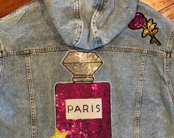 ミュージシャン CHRONOIZM PATCH DENIM JACKET Bougie Denim Jacket With Hood and Multiple Sequin Patches