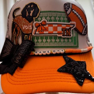 Tennessee football trucker hat.   Multiple patches.   Patterned mesh with footballs, bows,  pennants and more .   Beaded Game Day chain.
