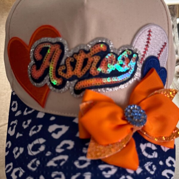 ASTROS ball cap .   Blue and white leopard print on hat brim .