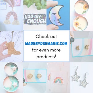 May include: A collage of handmade items including a rainbow wall hanging, a sticker that says "you are enough", a moon-shaped sticker, a candle with a pressed flower, a wooden boot, a pair of moon-shaped earrings, a candle with a star, a pair of smiley face earrings, a card with a rainbow and the text "happy thoughts", and a pair of star-shaped earrings. The text "Check out MADEBYDEEMARIE.COM for even more products!" is also included.