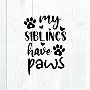 May include: Black and white graphic text on a white wood background. The text reads "my siblings have paws" with paw prints and hearts.