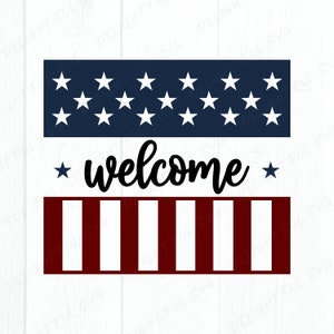 May include: A red, white, and blue welcome sign with a banner of stars and stripes and the word "welcome" in black cursive lettering.