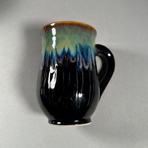 Unique black, green and blue carved mug