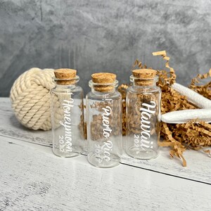 Mini glass bottles with honeymoon destination on it applied with vinyl