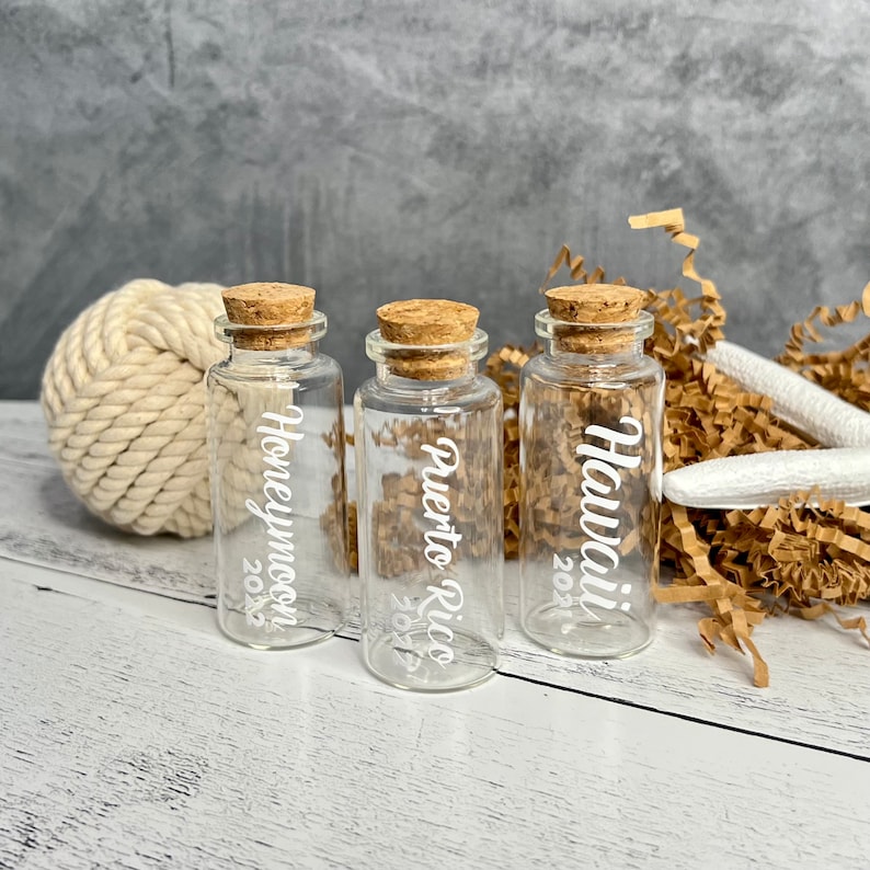 Mini glass bottles with honeymoon destination on it applied with vinyl