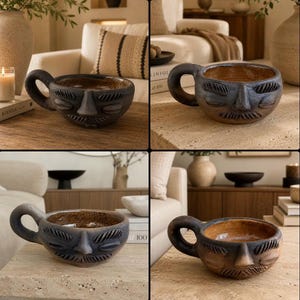May include: A dark brown ceramic mug featuring a sculpted human face on the exterior. The mug has a single rounded handle, a wide circular opening, and a smooth, glossy interior finish. The face design includes carved eyes, a nose, and a mustache.