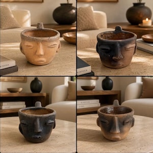 May include: A set of four ceramic planters shaped like human heads, each featuring a unique finish ranging from light tan to dark charcoal. These vessels have a small tab at the top rim, sculpted facial features including eyes, nose, and lips.