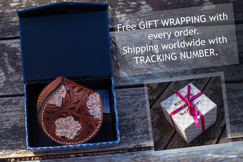 May include: A brown leather coin purse with floral tooled designs is displayed in a blue box. The box is open and the purse is visible. The text "Free GIFT WRAPPING with every order. Shipping worldwide with TRACKING NUMBER." is visible in the background.