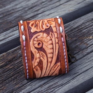 Brown leather keychain with western floral design, personalized tooled leather AirPods case, buck stitching AirPods case
