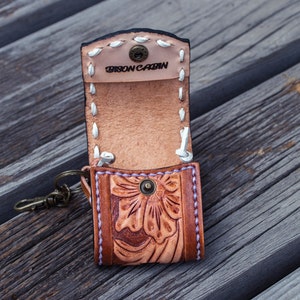 Brown leather keychain with western floral design, personalized tooled leather AirPods case, buck stitching AirPods case