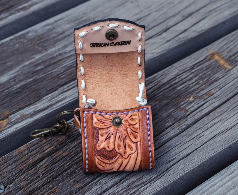 Brown leather keychain with western floral design, personalized tooled leather AirPods case, buck stitching AirPods case