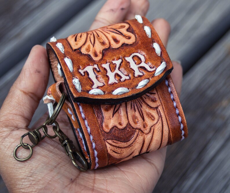 Brown leather keychain with western floral design, personalized tooled leather AirPods case, buck stitching AirPods case