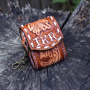 Brown leather keychain with western floral design, personalized tooled leather AirPods case, buck stitching AirPods case