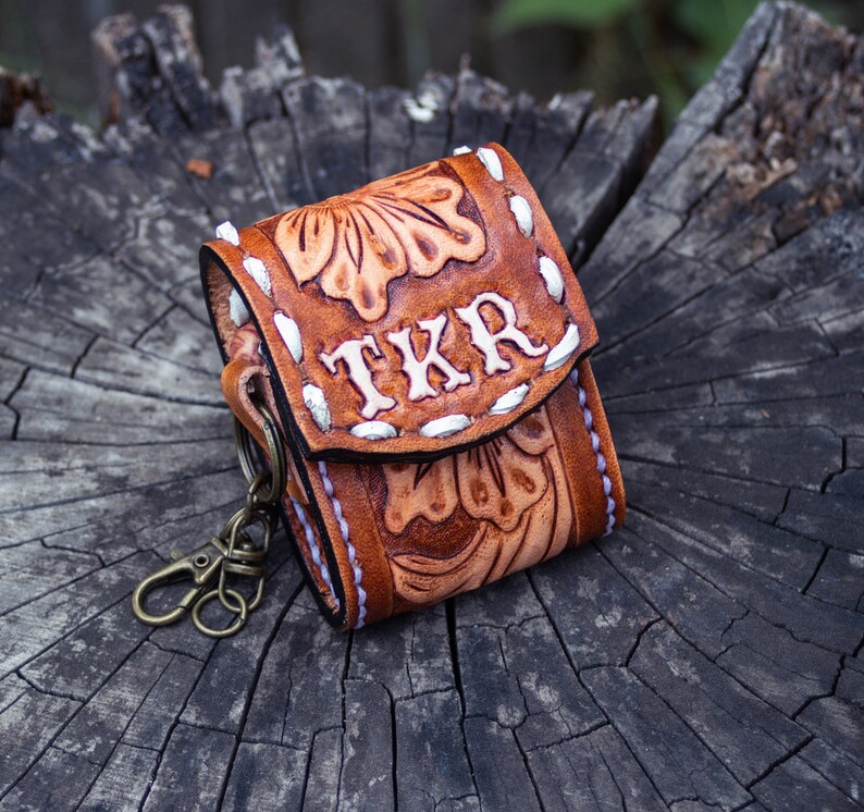 Brown leather keychain with western floral design, personalized tooled leather AirPods case, buck stitching AirPods case
