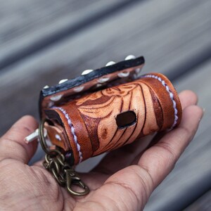 Brown leather keychain with western floral design, personalized tooled leather AirPods case, buck stitching AirPods case