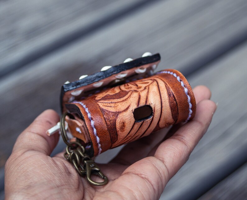 Brown leather keychain with western floral design, personalized tooled leather AirPods case, buck stitching AirPods case