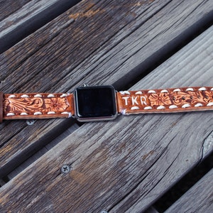 Brown cowhide leather Apple Watch band with western floral design, personalized tooled leather, buck stitching, custom initials embossed.