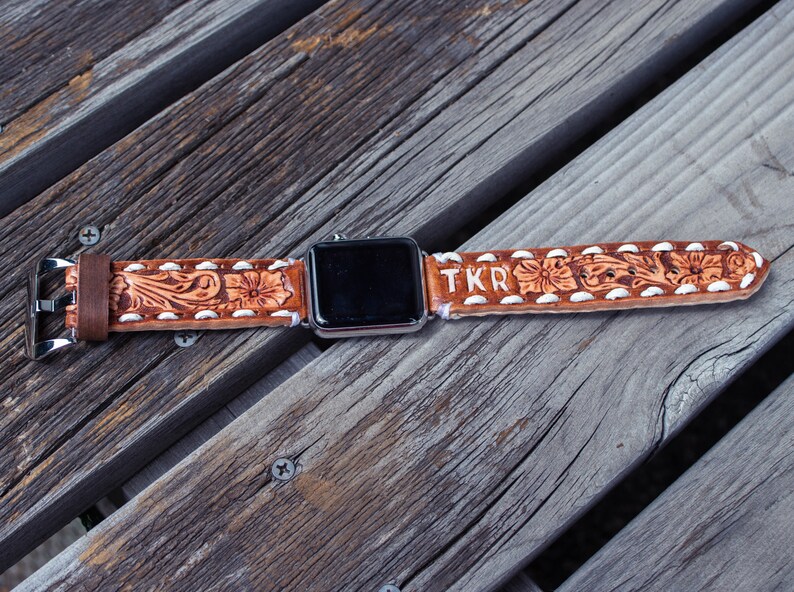 Brown cowhide leather Apple Watch band with western floral design, personalized tooled leather, buck stitching, custom initials embossed.