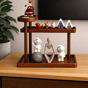 May include: A wooden decorative shelf unit with multiple tiers, showcasing various ornaments. The top shelf features a Santa Claus figure and festive decorations. The lower shelves display astronaut figurines and abstract sculptures.