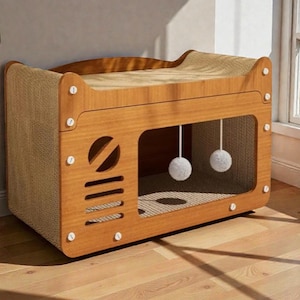 May include: A wooden cat house with a built-in scratching surface and a playful design. The structure features a light brown wood frame with a woven sisal scratching surface and two hanging pom-poms for entertainment.