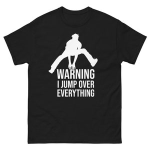 May include: Black t-shirt with a white silhouette of a person jumping and the text "WARNING I JUMP OVER EVERYTHING".