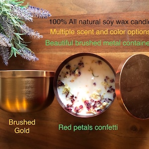May include: A soy wax candle with red petals confetti in a brushed gold metal container. The candle is 100% natural soy wax and has multiple scent and color options.