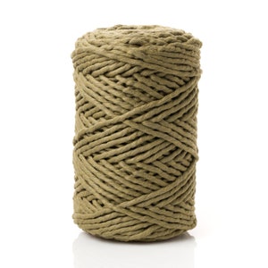 May include: A spool of thick, olive green cotton rope. The rope is tightly wound and has a natural, rustic look.