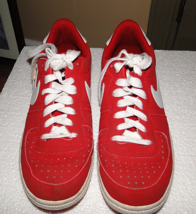 white nikes with red