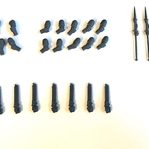 May include: A set of grey plastic miniature figures for a tabletop wargame. The set includes various weapons, arms, and legs.