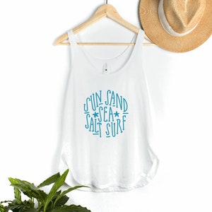 May include: White tank top with a blue graphic that says "Sun Sand Sea Salt Surf" with two stars.
