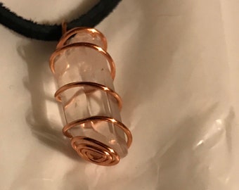 Hand twisted copper spiral cage With quartz crystal stone.